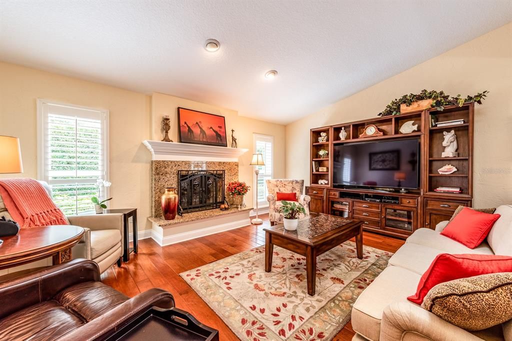 Follow the bright open foyer into the spacious DINING and LIVING ROOM areas, spend a cozy evening by the FIREPLACE or entertain guests for dinner!