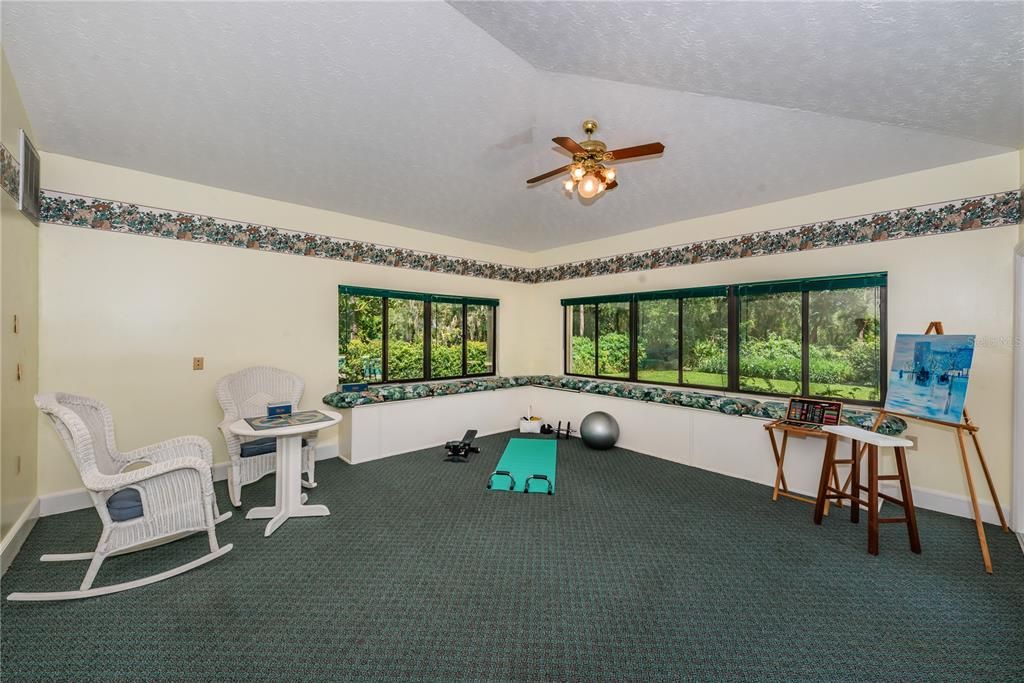 Multi-purpose room adjacent to kitchen and access to pool area