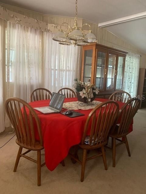 Dining Area. Dining Room Table, chairs and matching China Cabinet conveys with Property