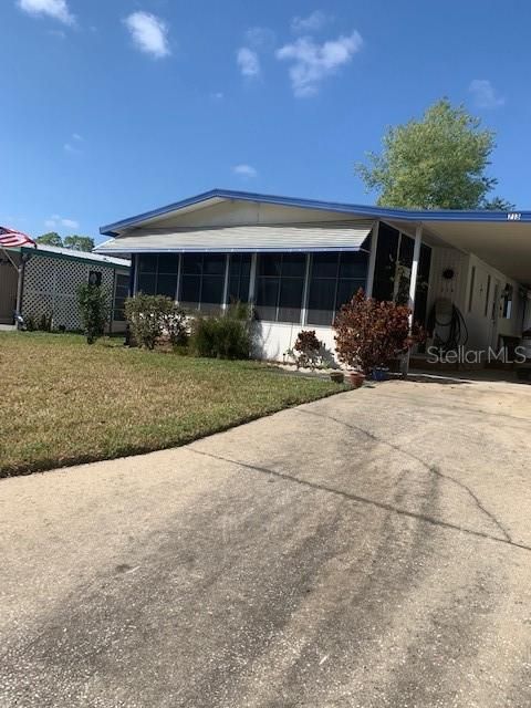 Side View of Carport and House