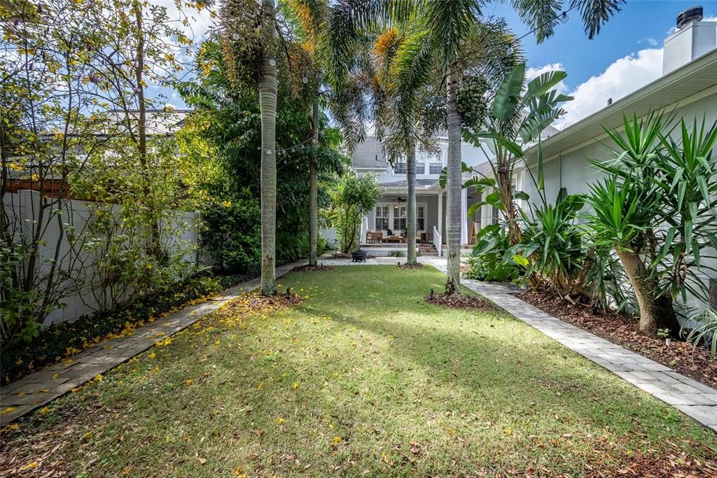 Florida Living with mature tropical  ladscping and paver courtyard, yes you can add a pool.