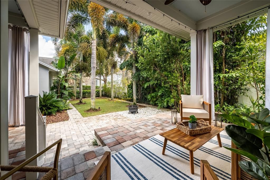 Covered lanai with pavers with mature tropical  ladscping and paver courtyard, yes you can add a pool.