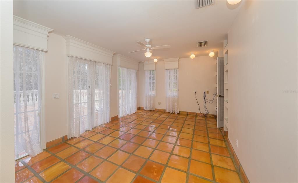 bedroom with large patio and french doors