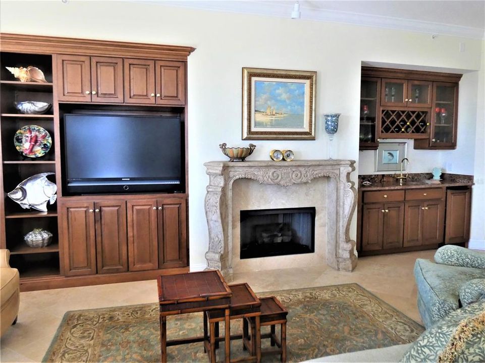 BUILT INS, DECORATIVE FIREPLACE AND WET BAR IN GREAT ROOM