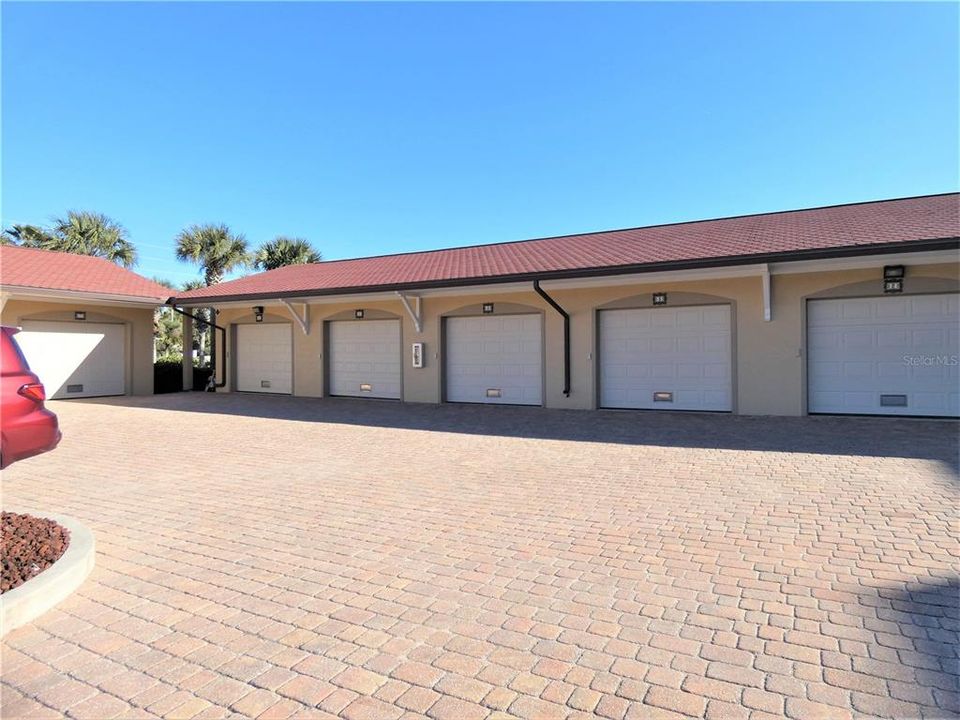 PAVER COURTYARD AREA IN FRONT OF COMPLEX AND GARAGES