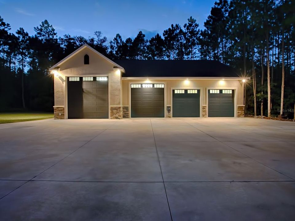 DETACHED 4-BAY GARAGE INCLUDES PLENTY OF ROOM FOR THE RV ENTHUSIAST