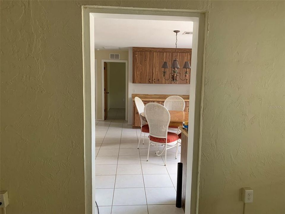 Living room looking in dining and kitchen