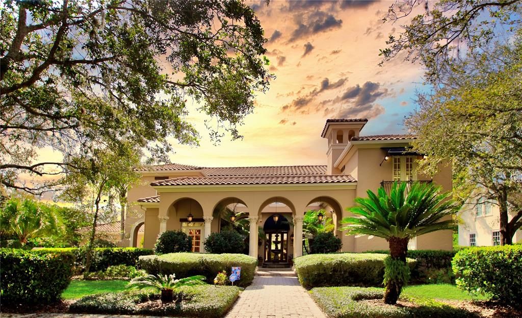 Front of home with a welcoming courtyard entrance