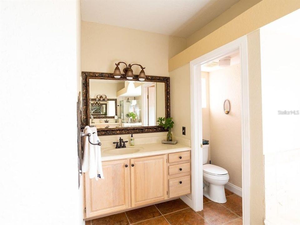 Master bathroom his and her vanity with half bath