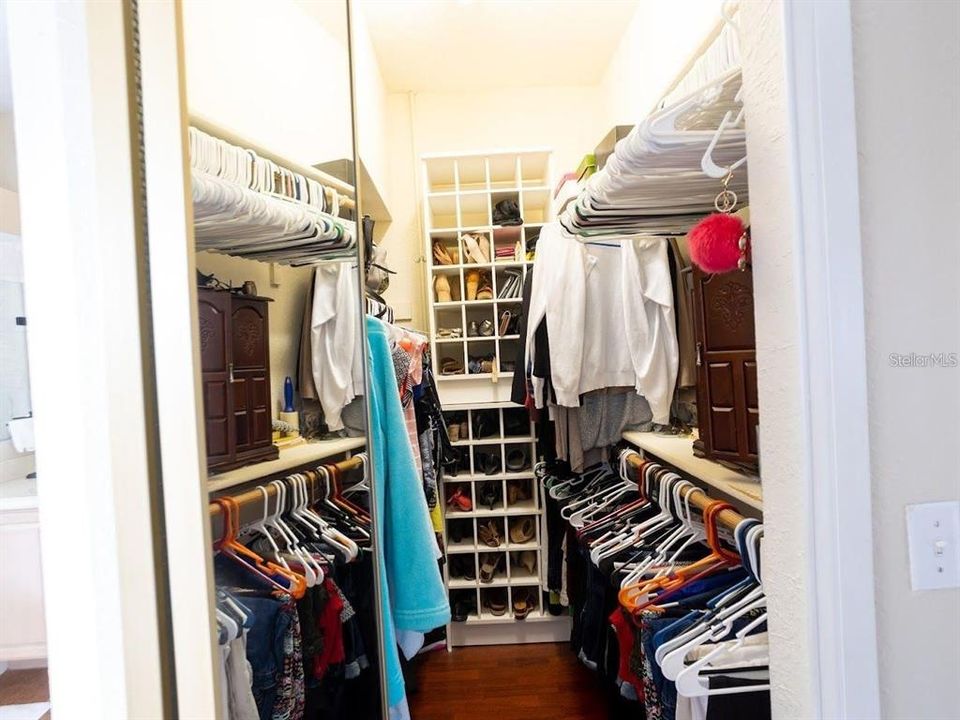 Master bedroom his and her closet