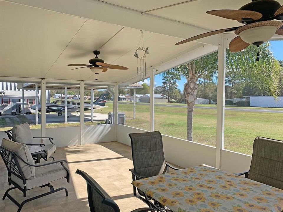 Screened patio with runway view