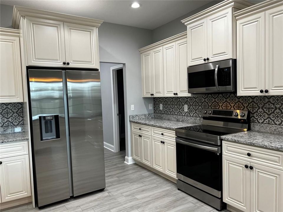 Kitchen with view to Utility Room and Mud Room