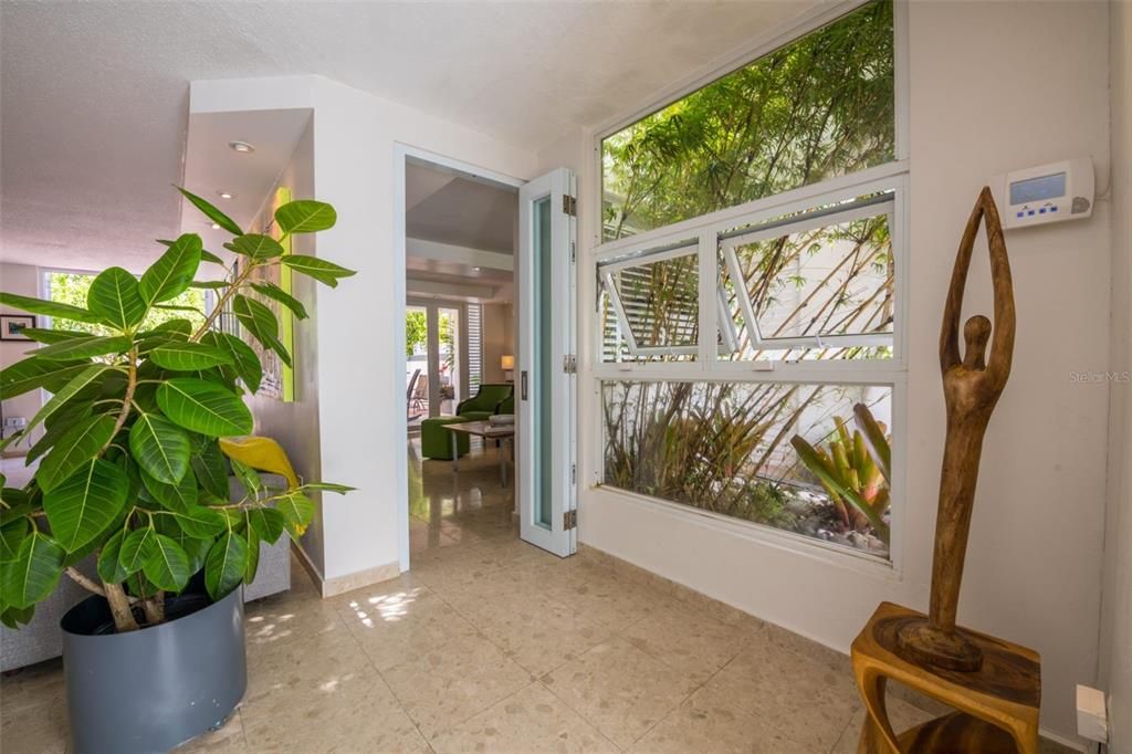 Foyer with view of side garden