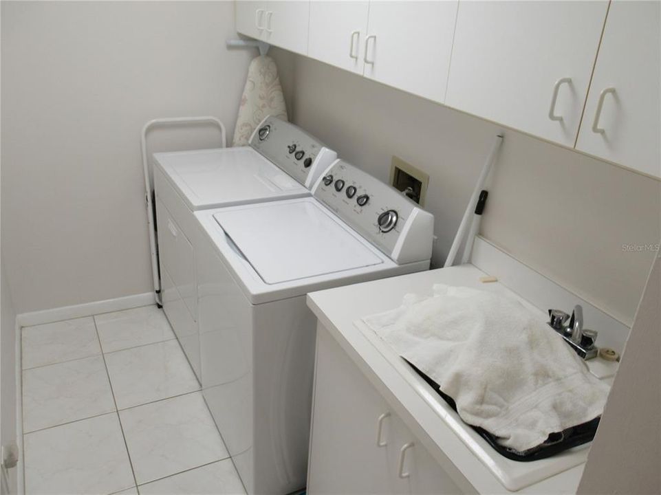 Utility Room in unit w/full size washer, dryer & sink