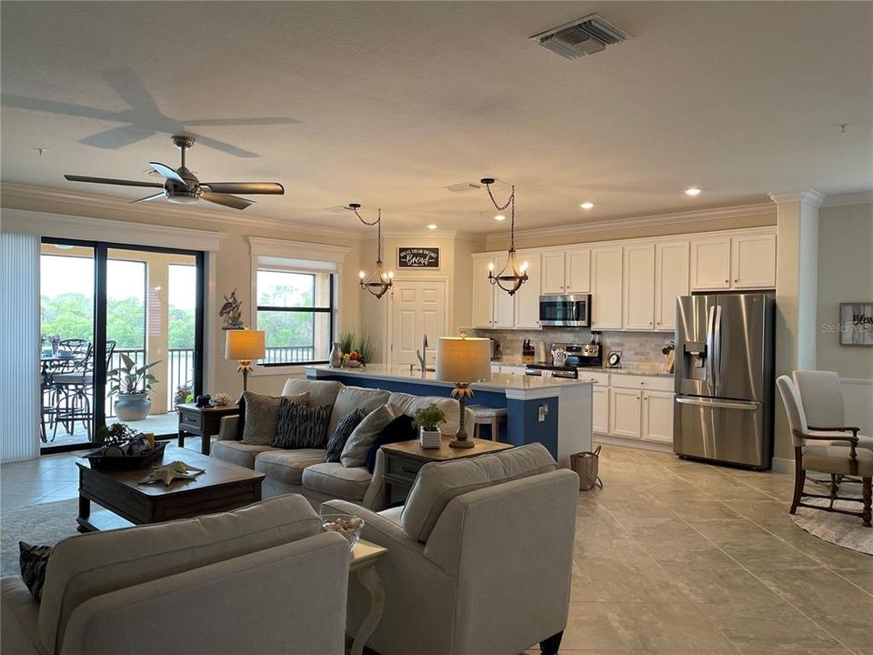 The kitchen, family/great room and dining area create a large area for entertaining and relaxing.