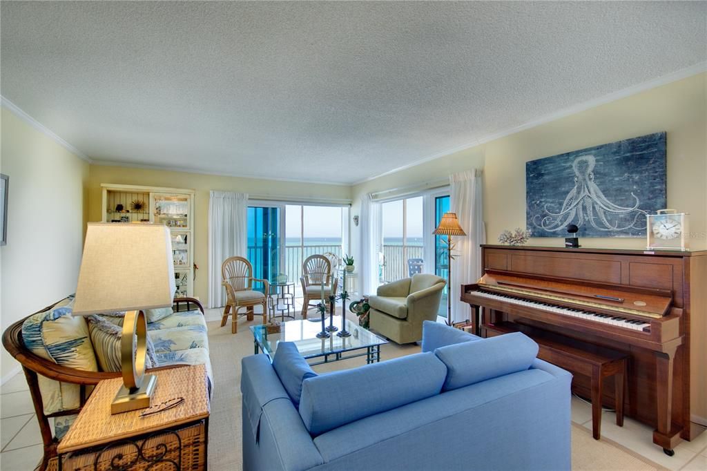 Your spacious living room has Gulf views and two sliders leading out to the front lanai.