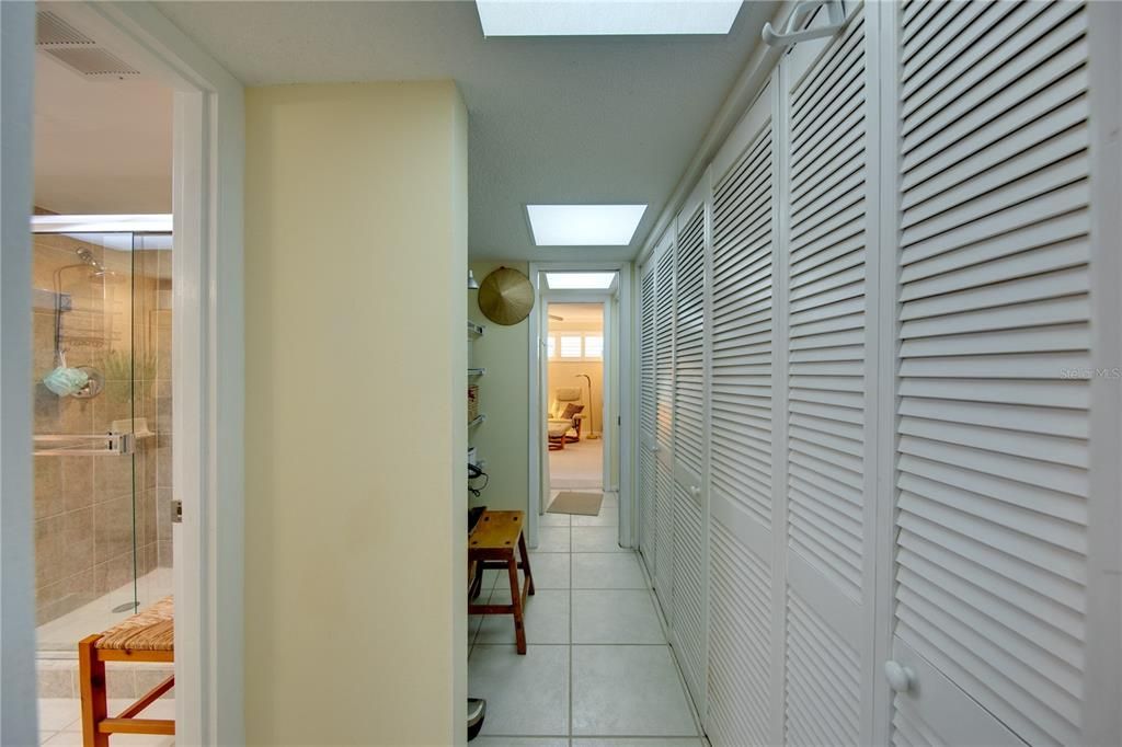 View of the closet area and hallway that connects both bedrooms.