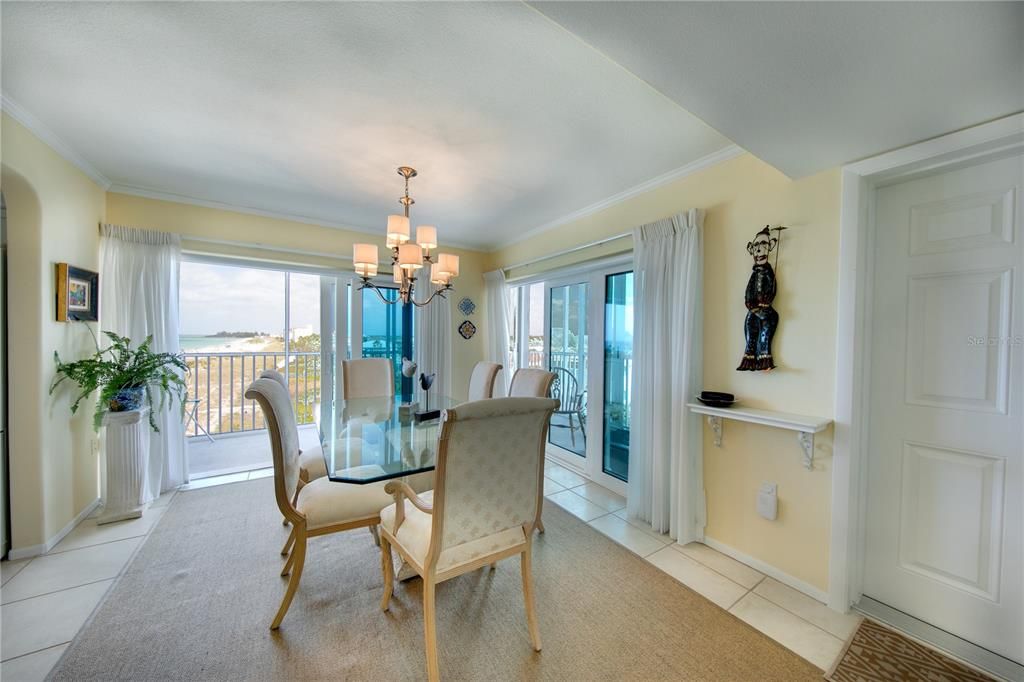 The dining room and its Gulf views are what greets you when you enter the condo.