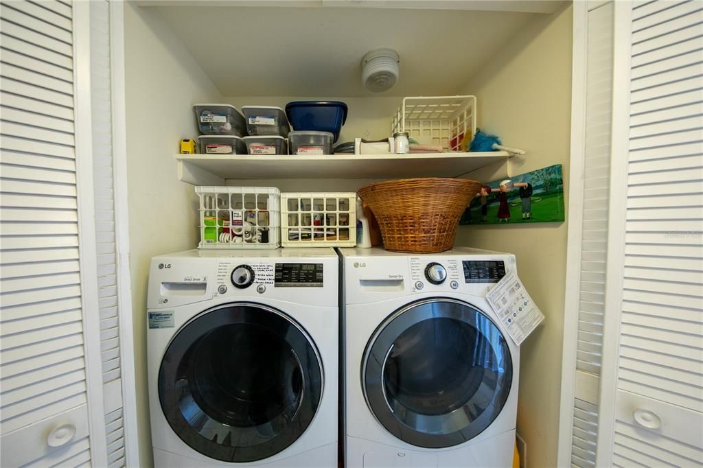 Full-size washer and dryer are in the hallway closet.