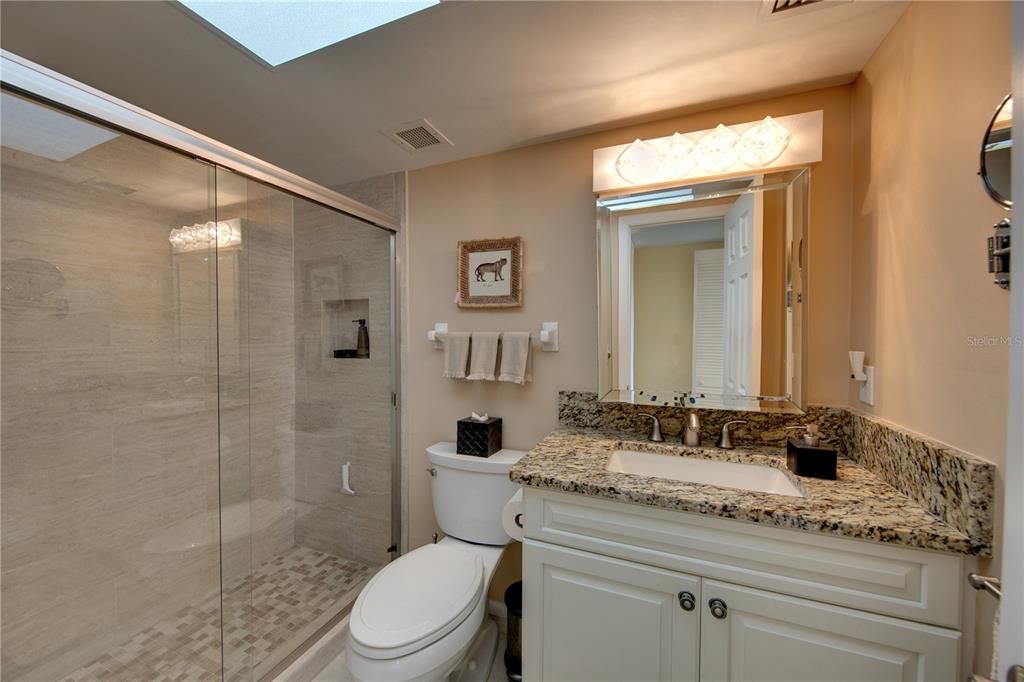 Guest bathroom, just off of the dining room and the guest bedroom, has also been fully updated.