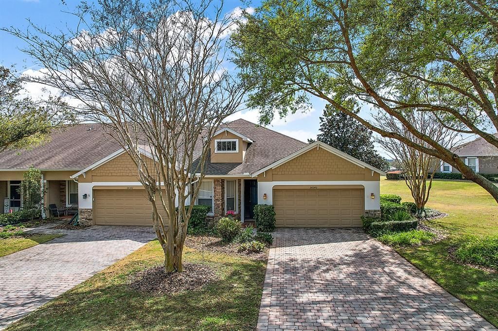 paver driveway to two car garage. All outside yard maintenance is included in monthly fee