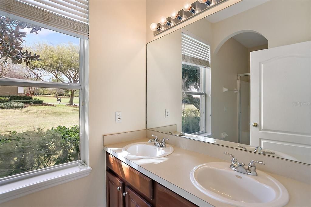 En Suite bathroom for the main bedroom-dual sinks, commode and shower only