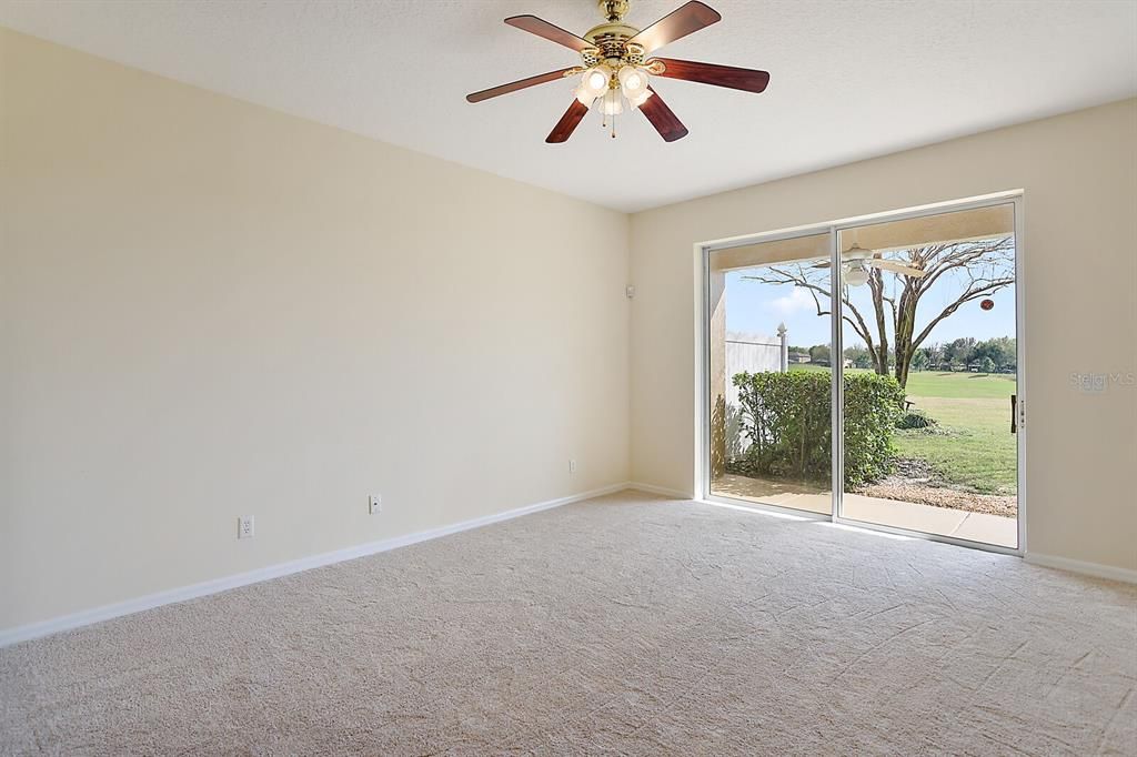 Family room with sliding glass doors to lanai and views of the golf course