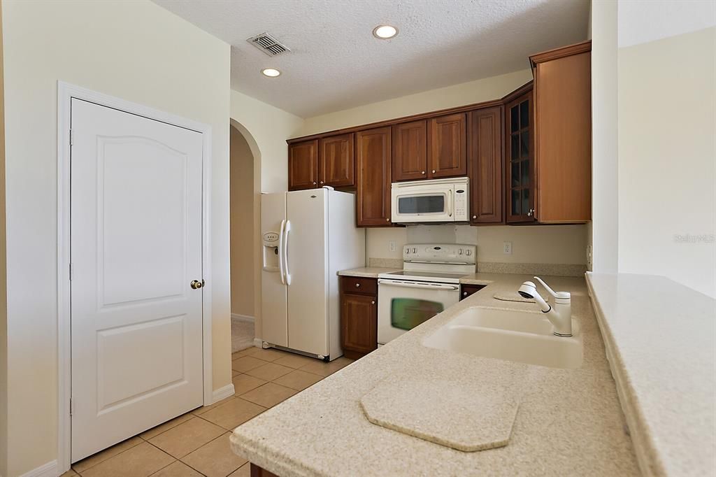 This is a large closet pantry with plenty of shelving