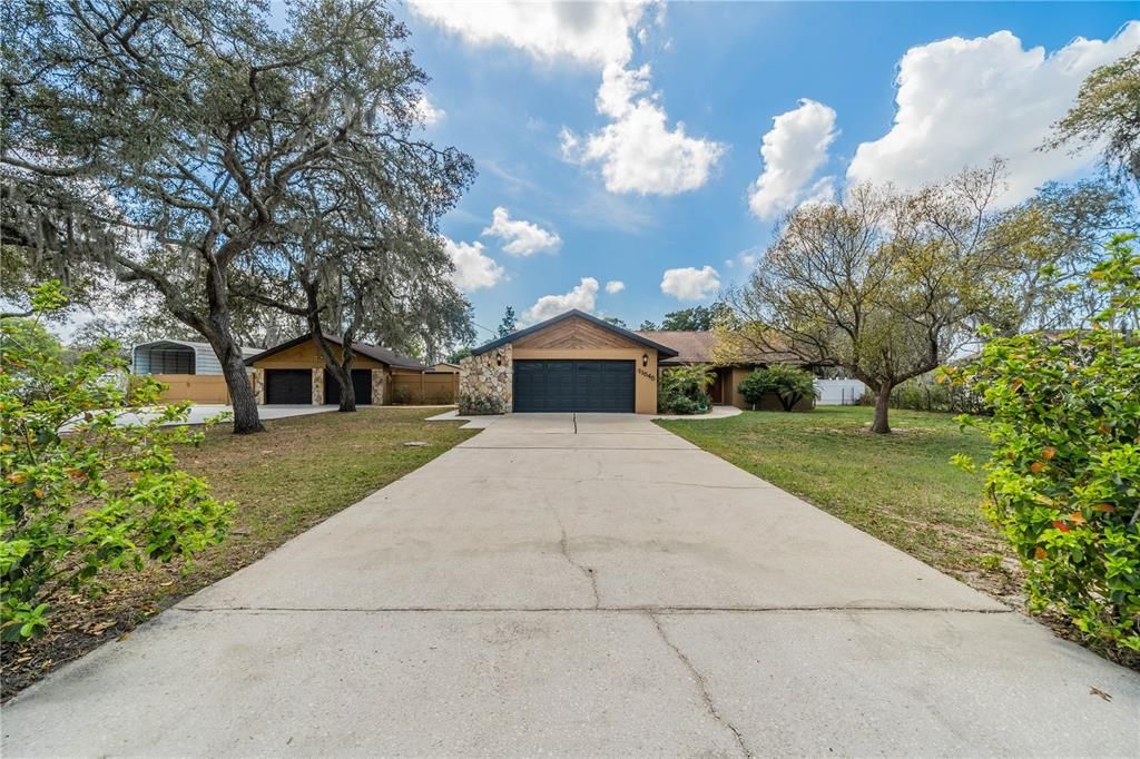 Front of house with 2 driveways