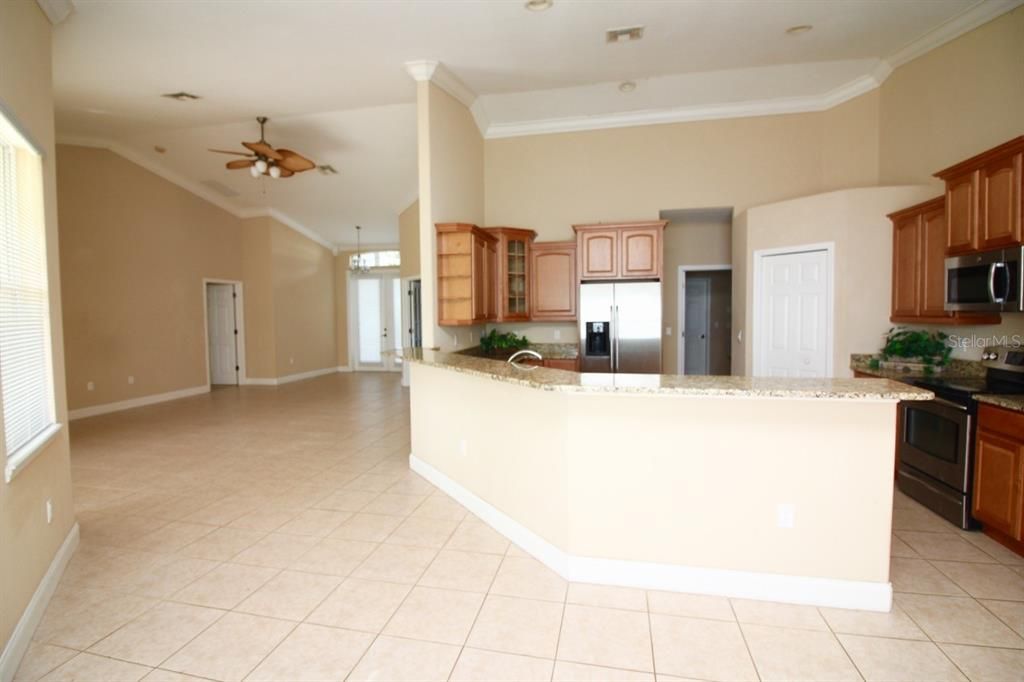 VIEW OF DINING ROOM, KITCHEN, GREAT ROOM, MASTER BEDROOM SUITE AND FRONT ENTRY