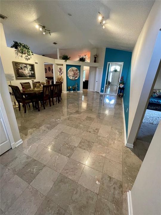 Marble flooring throughout the living room