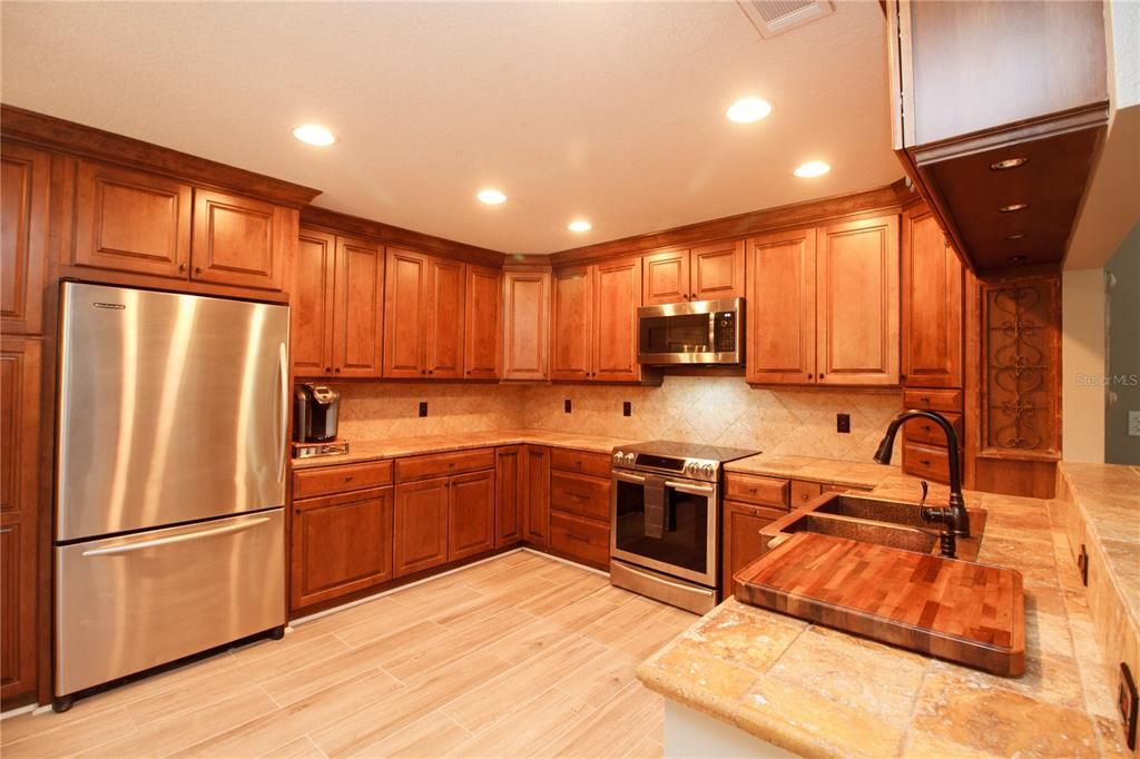 SS Appliances - Wood Cabinets - Tile counters