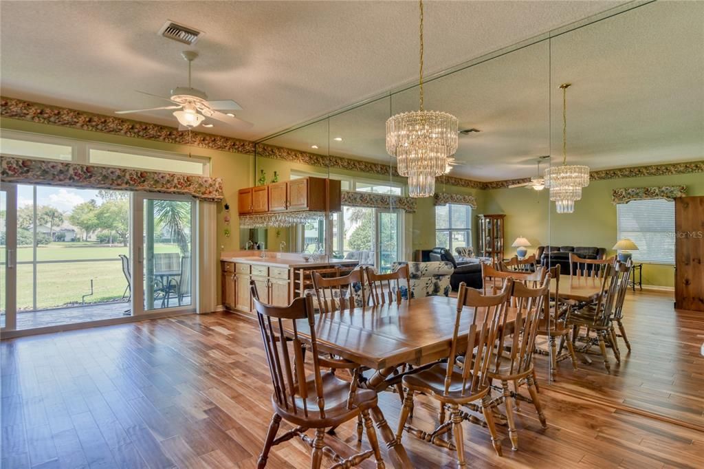 Dining Room with Chandelier and Hardwood Flooring