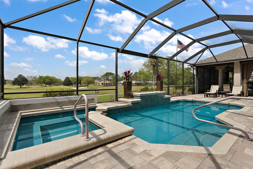 Pool with water feature and hot tub