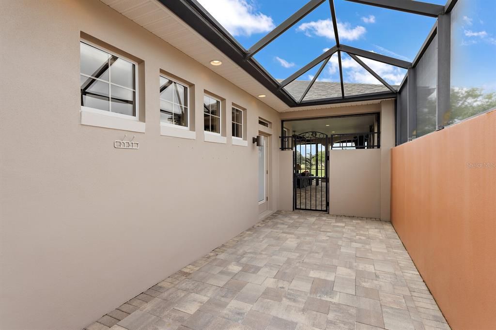 Birdcaged paver walkway to back lanai