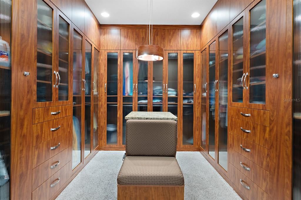 Extraordinary walk in closet with custom built ins