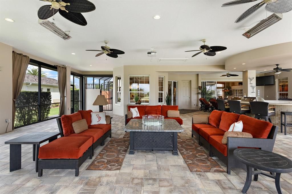Outside living area with multiple ceiling fans