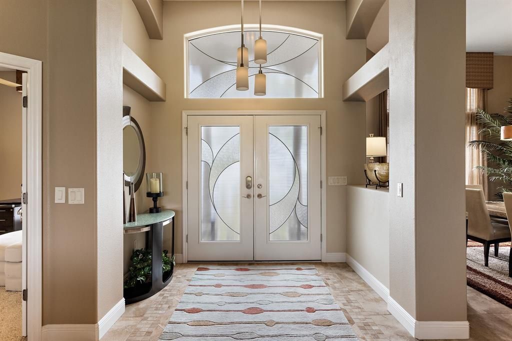 Foyer with high ceiling and upgraded light fixture