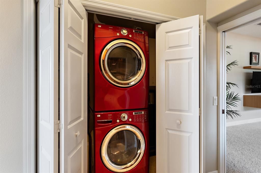 Master bedroom with stackable washer & dryer