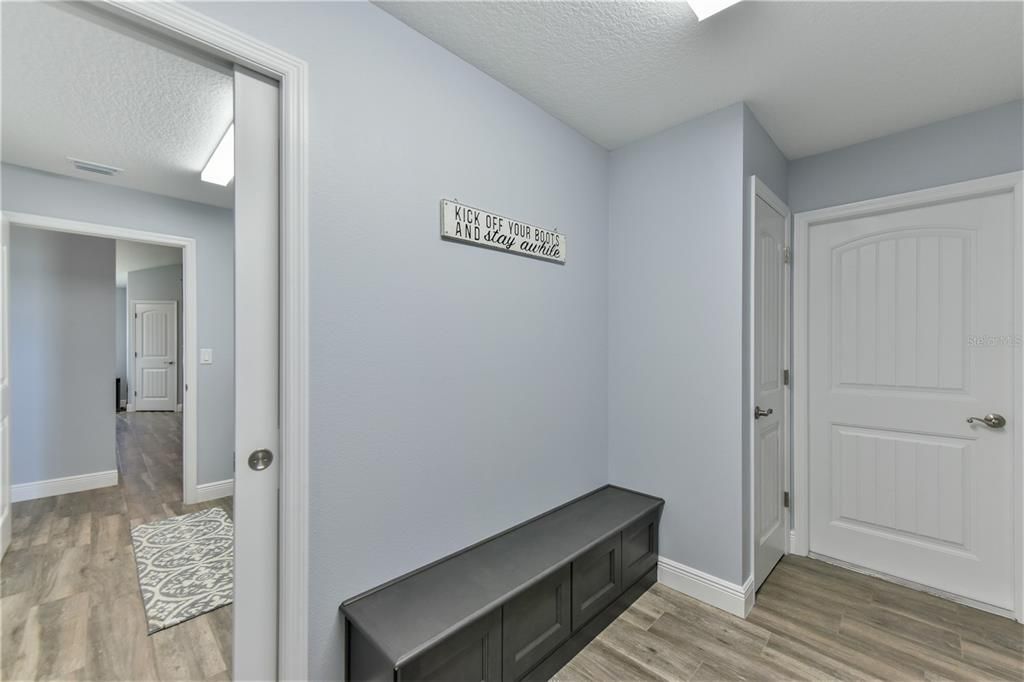 mudroom with outdoor and garage entrance