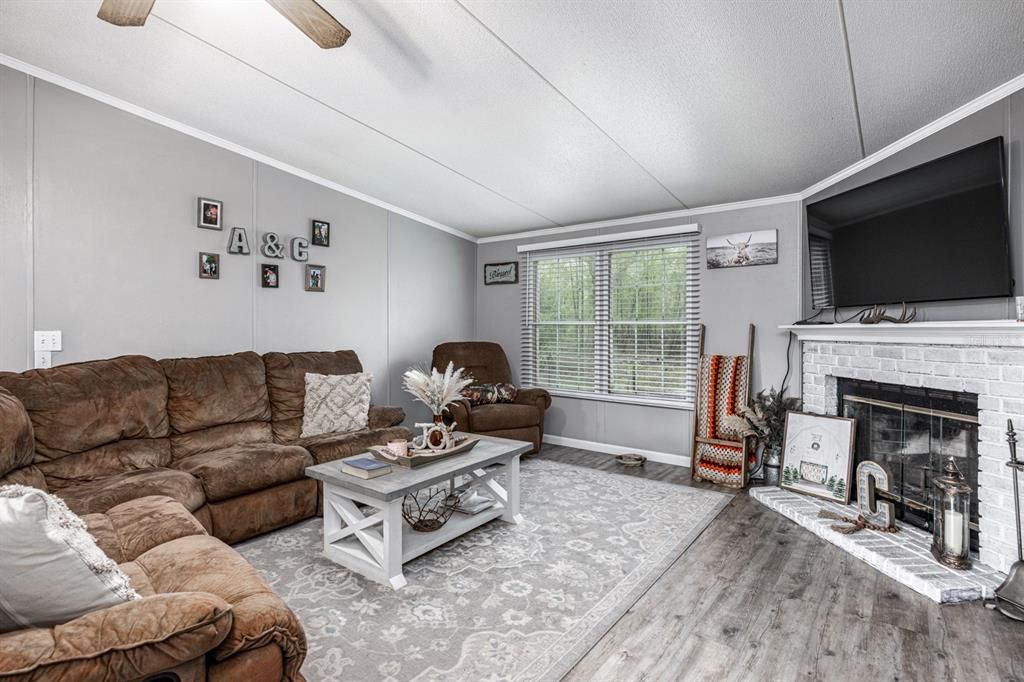 Vaulted Great Room with wood burning fireplace