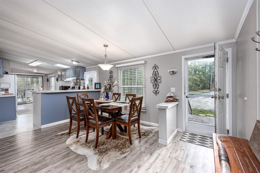 Open floor plan with updated laminate flooring