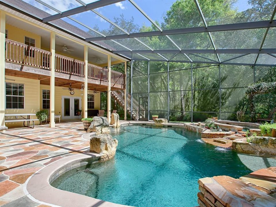 Back pool deck view of upper and lower porches