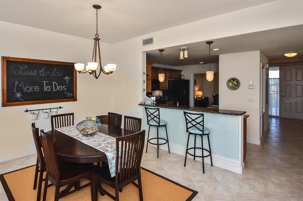 Dining room to kitchen and foyer