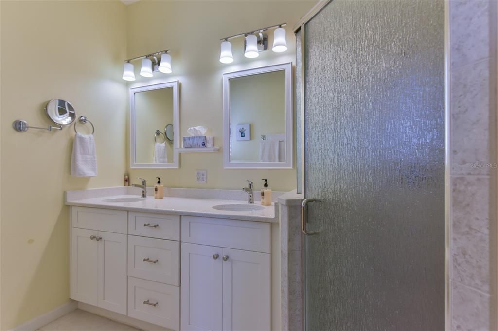 Master Bathroom with High Double Sink Vanity, new Lighting Fixtures and Walk-In Shower