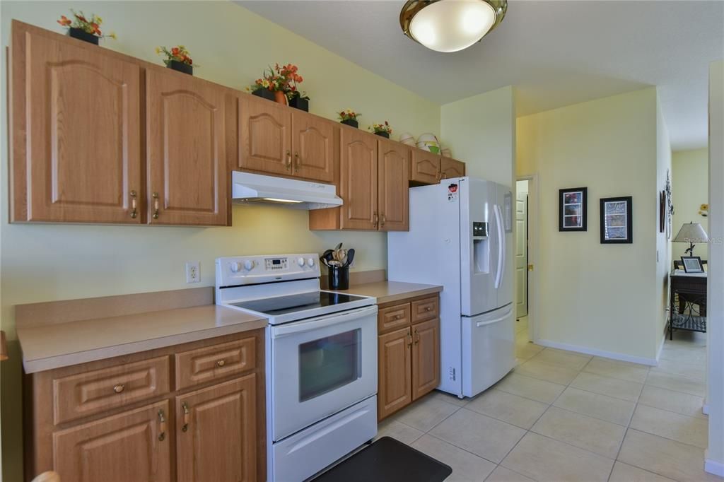 Upgraded Kitchen with White Appliances and French Door Refrigerator
