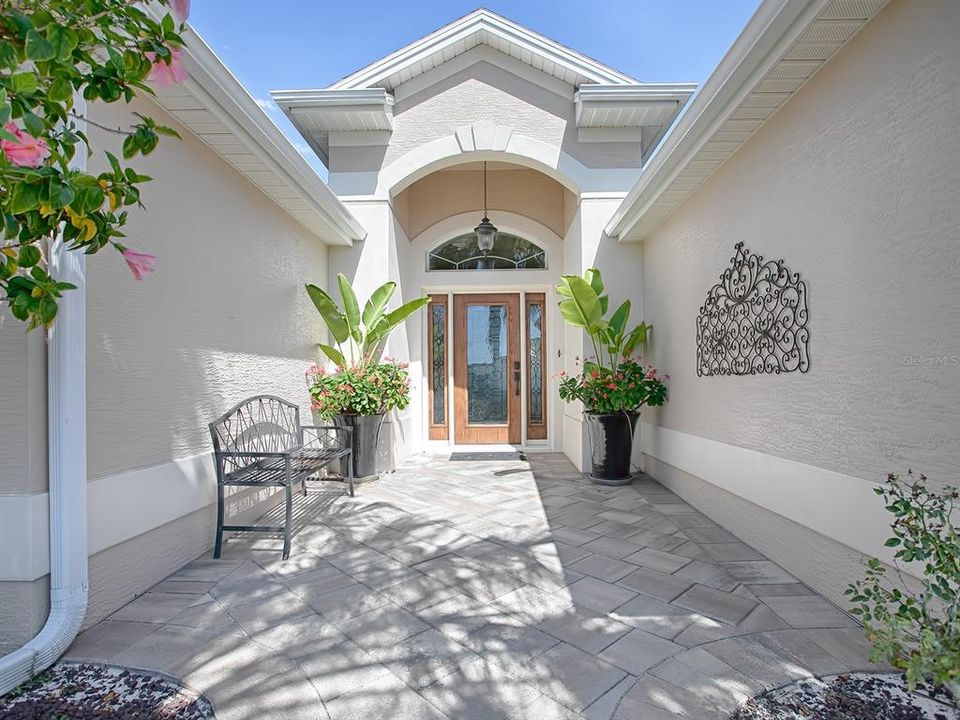 WHAT AN INVITIN ENTRANCE WITH FULL FRONT PATIO!
