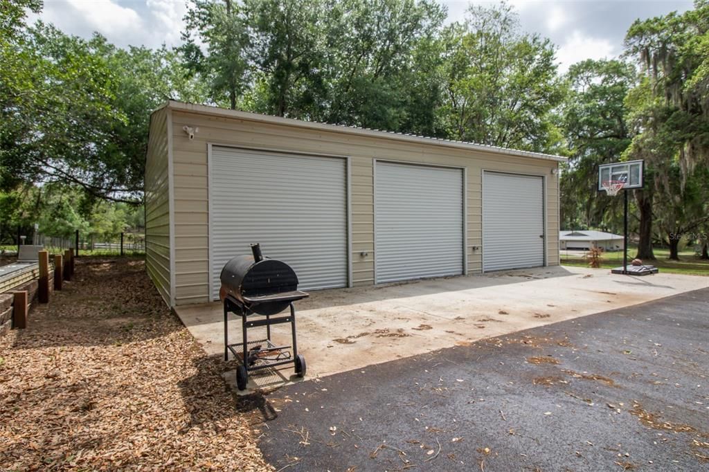 New 3 bay metal workshop with concrete, electric, water, & office with AC
