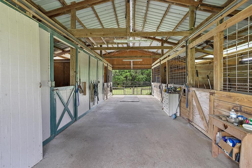 Four-Stalls, all with Water spigots inside and outside fir water buckets, Dutch Doors open to Paddocks/Pastures.