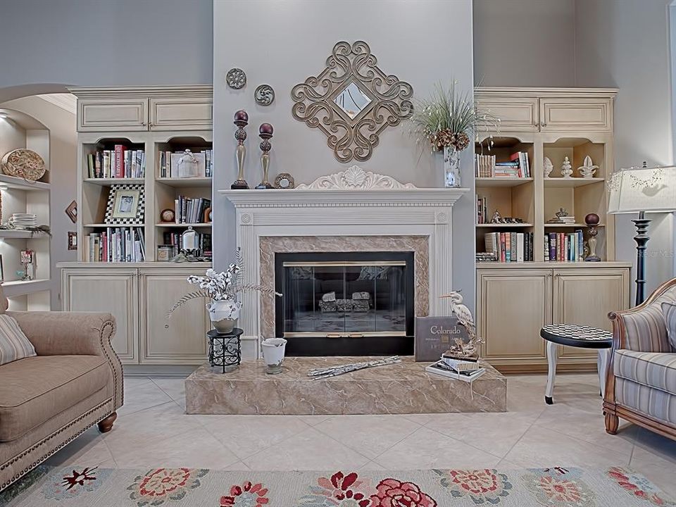 WHAT A BEAUTIFUL FIREPLACE AND BUILT-IN CABINETRY!